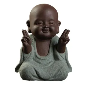 Buddha Statuette and the Monk in Blue