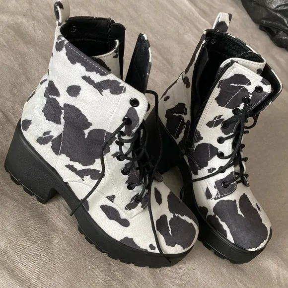 Hard to find faux suede caw print lace up and zipper boots.